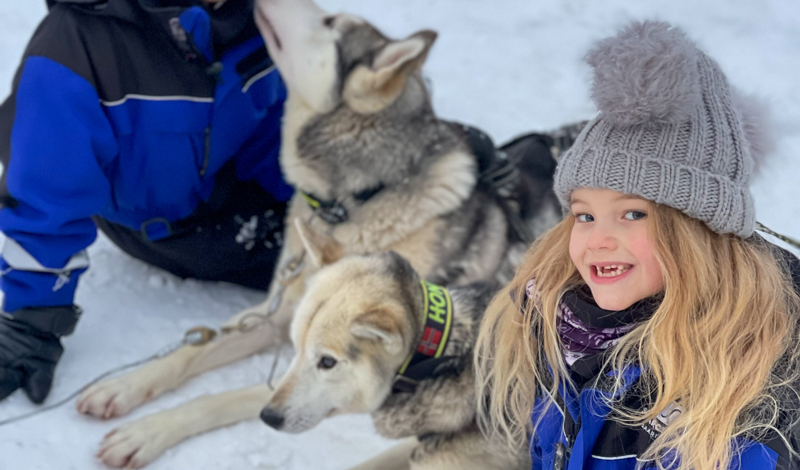 children with huskies