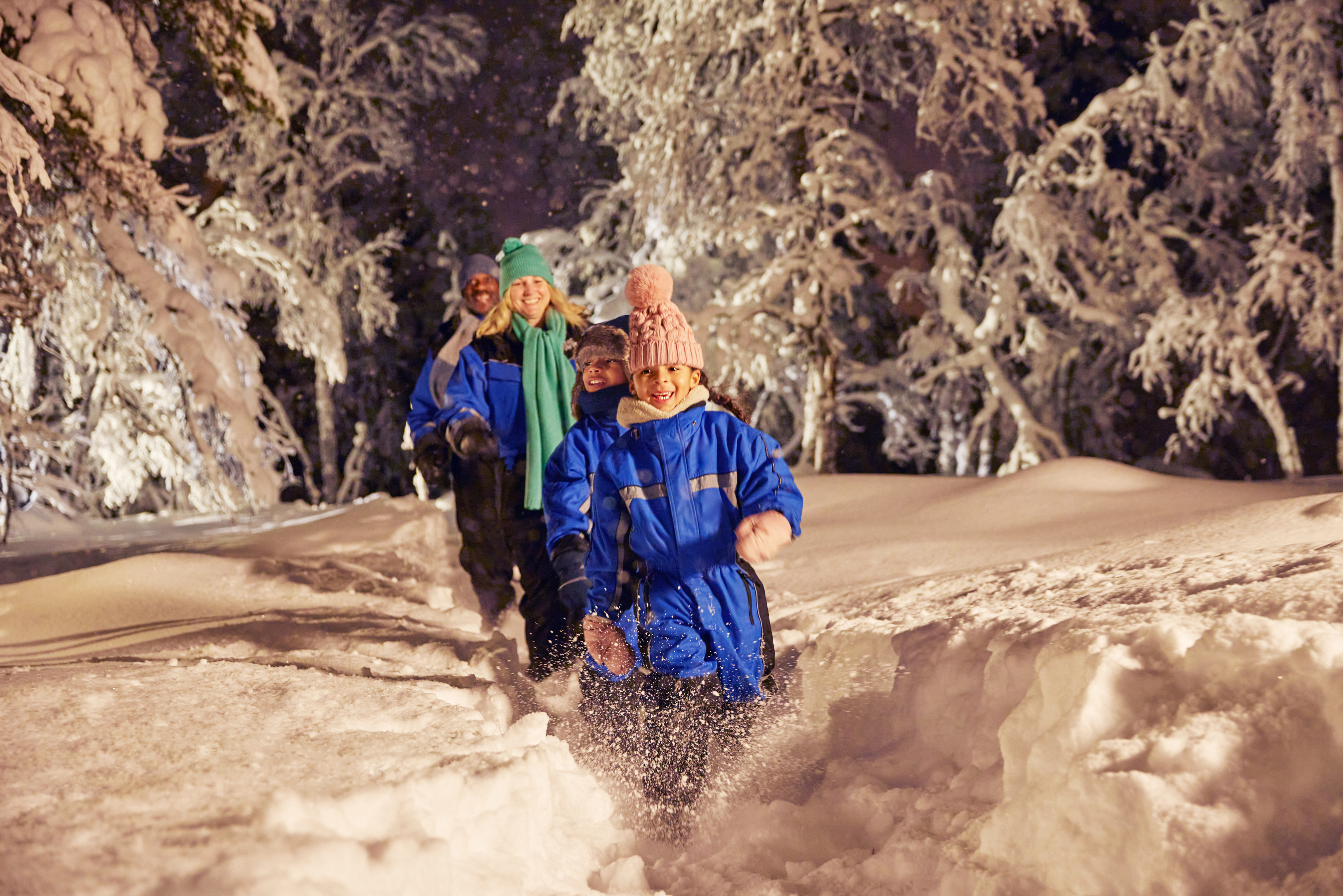 smiling family fun in snow