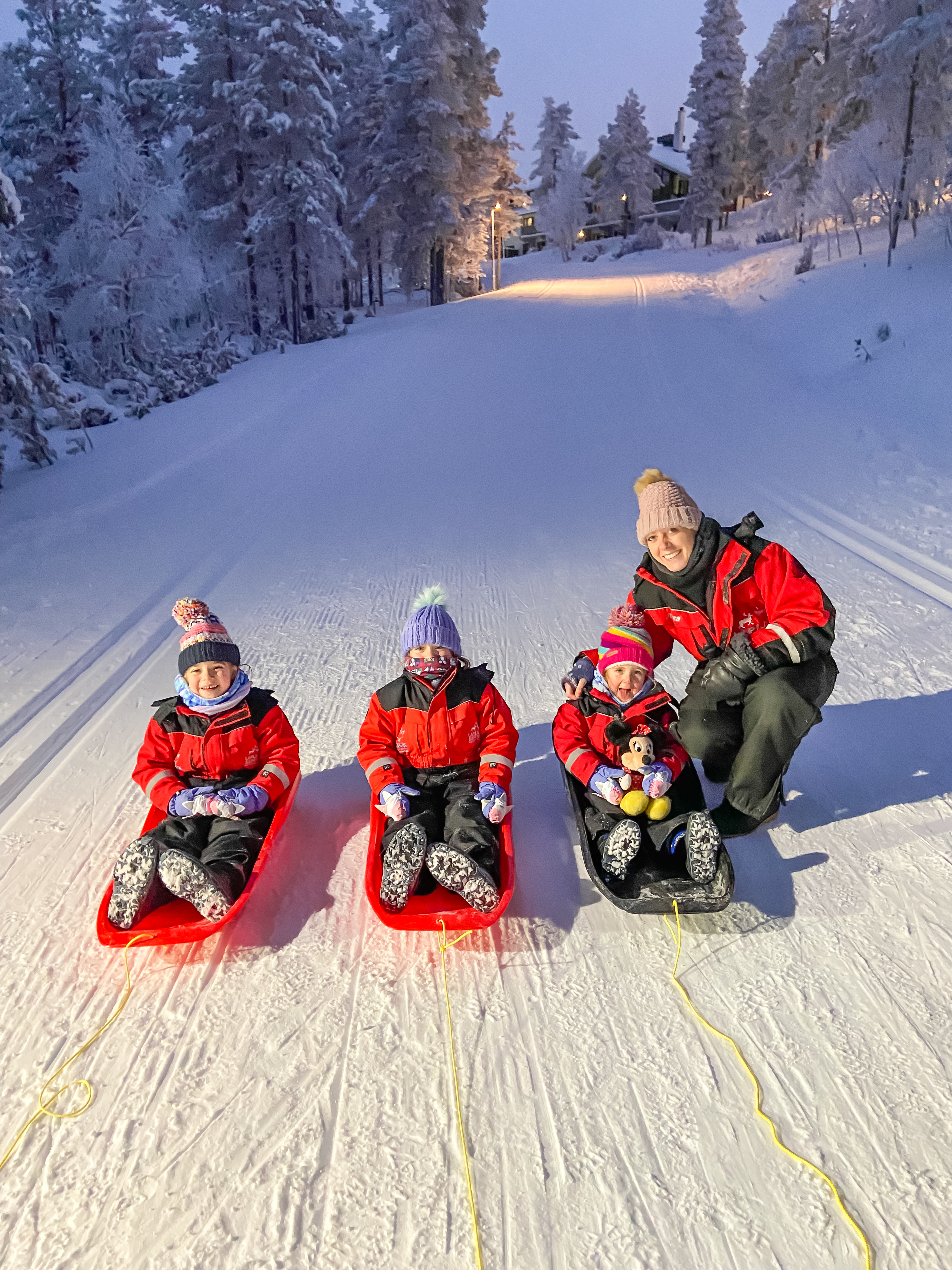 Twins and Travels taboganning in Lapland